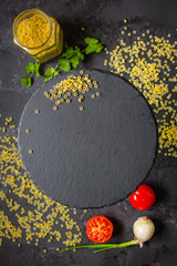 pasta aneli - a set of ingredients for cooking pasta  (dark background). top view. copy space