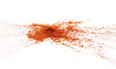 Pile of red grounded pepper, paprika powder isolated on white background