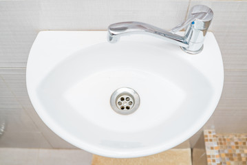 The photo of a sink in a bathroom