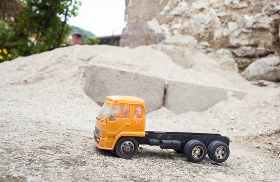 Yellow Toy truck on the sand