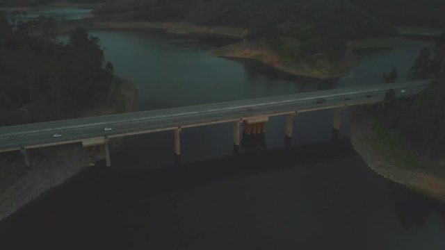 twilight drone aerial shot of bridge in scenic lights