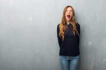 Telemarketer woman shouting to the front with mouth wide open