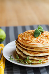 Fresh, delicious pancakes with walnuts on wooden table