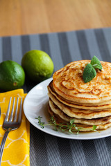 Fresh, delicious pancakes with walnuts on wooden table