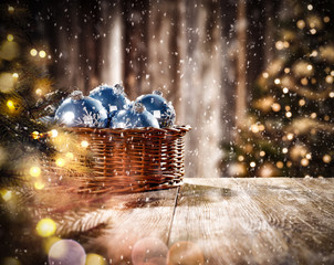 Christmas balls on table and snowflakes 