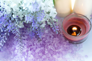 Obraz na płótnie Canvas Lavender aromatherapy Spa with candle. Thai Spa relax Treatments and massage white background. Healthy Concept. select and soft focus.