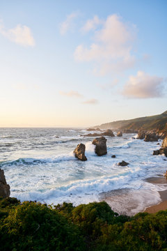 Waves by cliffs in Big Sur, USA