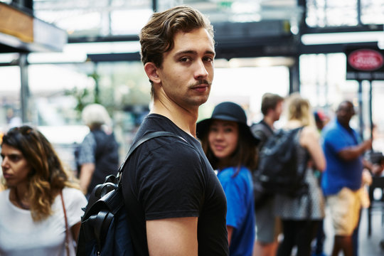Young man in Torvehallerne Market in Copenhagen, Denmark