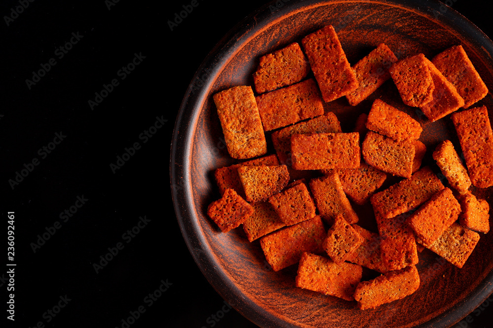 Sticker the background of rye croutons on the plate copy space place for text