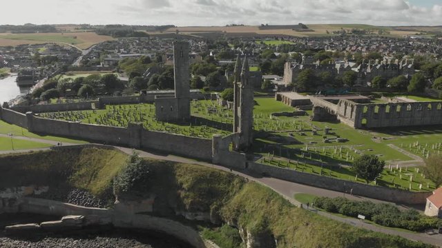 Aerial drone view of St Andrews Cathedral and cemetery grounds. ESTABLISHING, RISING, TILT-DOWN. 4K shot on Mavic Air.