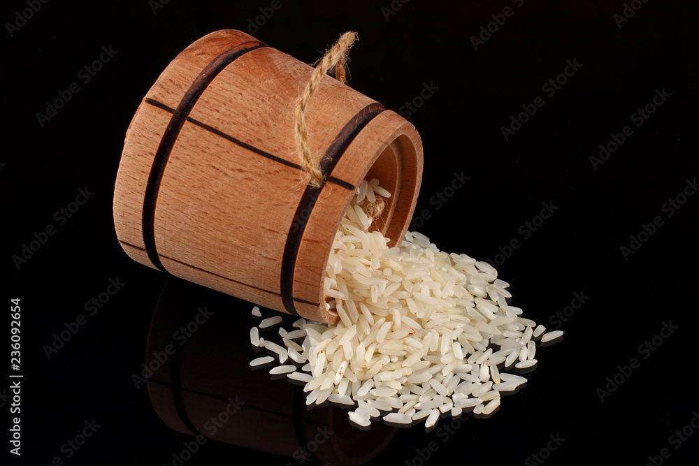 Canvas Prints Barrel with rice on a dark background