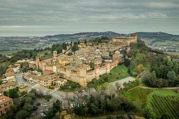 Fototapeta na wymiar Aerial view of the walled town and castle of Gradara in Marche Italy popular tourist destination of the well preserved double walls and castle