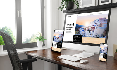black and white desktop with three devices showing  travel blog