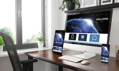 black and white desktop with three devices showing landing page