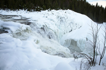 frozen waterfall Tannforsen in winter, Sweden