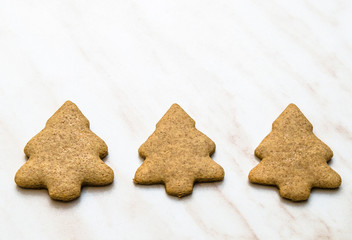Home-baked gingerbread on a kitchen surface with baking paper - Christmas concept with home-baked cookies in the kitchen