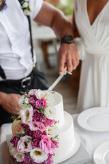 Obraz na płótnie Canvas Wedding cake with flowers. Wedding Celebration. Happy