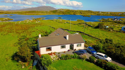 Fototapeta na wymiar irish holiday cottage in clifden ireland wild atlantic way with view of the sea and the mountains