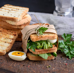 sandwich of French toast and lettuce leaves and boiled egg
