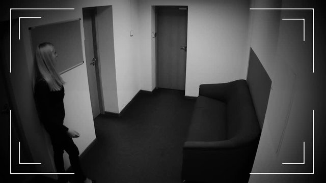 Woman losing consciousness in office corridor, poisoning, CCTV camera effect
