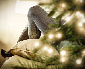Christmas time and woman slim legs with black shoes 