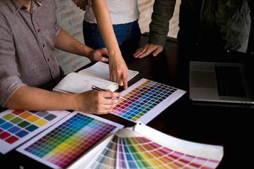 Graphic designers choose colors from the color bands samples for design .Designer graphic...