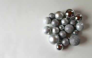 Silver christmas balls on white background