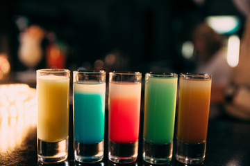 Cocktails at the bar with a blurred background.