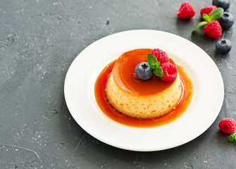 delicious dessert creme brulee with berries.