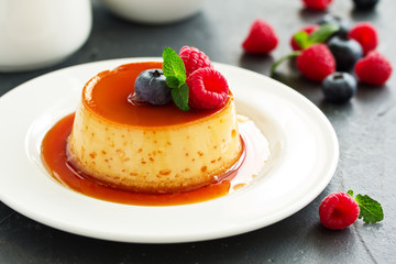 delicious dessert creme brulee with berries.
