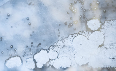 Winter background, frozen glass from strong frost, ice texture on the window