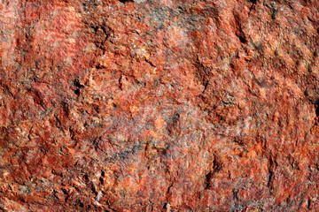 The structure of the natural is not polished granite red. Natural background, cropped picture,...