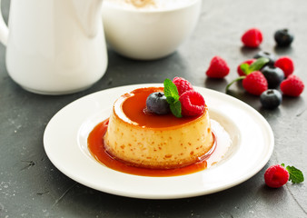 delicious dessert creme brulee with berries.