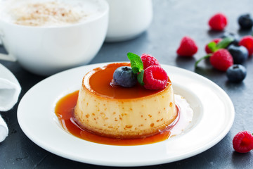 delicious dessert creme brulee with berries.