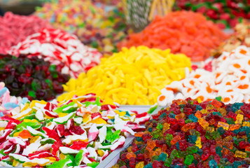 assortment colorful gummy candies at market (selective focus)