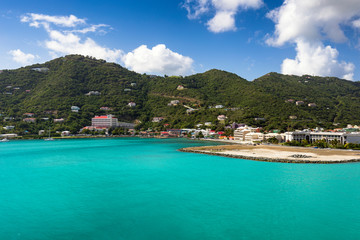 Fototapeta na wymiar Coastline along a Road Town in Tortola. Caribbean sea