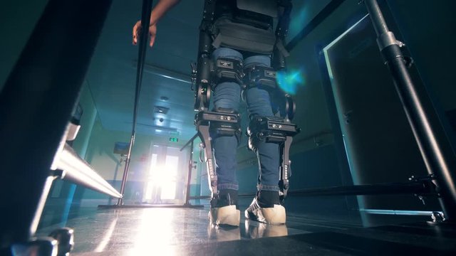 Person uses orthopaedic equipment. Futuristic medical technologies.