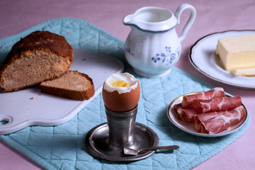 Breakfast - egg, butter, bread, bacon and butter
