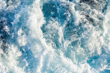 Fototapeta na wymiar Aerial view to ocean waves. Blue water background.