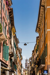 Fototapeta na wymiar A view of Torre dei Lamberti in Verona, Italy from the city streets