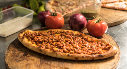 Traditional oven baked Macedonian meat pie pastrmajlija. Macedonian Pizza