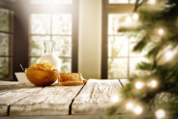 Christmas breakfast time with blurred background of window and christmas tree. 