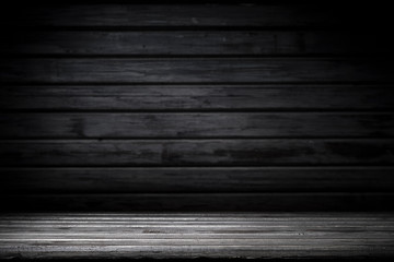 Dark room with tile floor and brick wall background