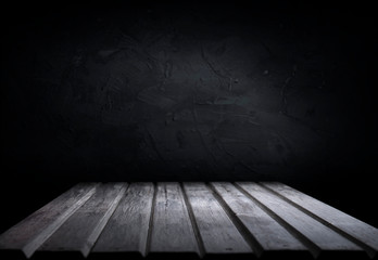 Dark room with tile floor and brick wall background