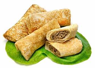 Pancakes with filling on a white background