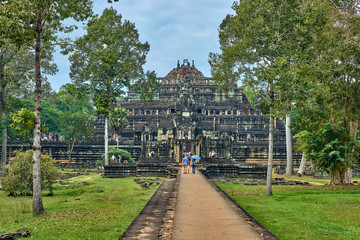 SIEM REAP, CAMBODIA - 13 December 2014:View of Baphuon temple at Angkor Wat complex is popular tourist attraction, Angkor Wat Archaeological Park in Siem Reap, Cambodia UNESCO World Heritage Site