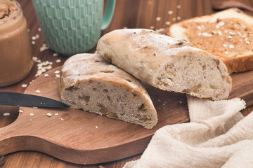 Healthy whole wheat kernels bread and sliced bread with peanut butter