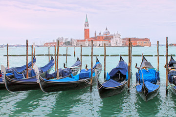 Fototapeta na wymiar View of gondolas on Grand Canal and San Giorgio Maggiore church. Venice cityscape. Italy.