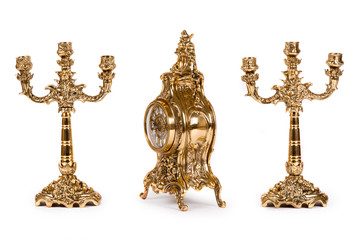 Vintage gold watch with candelabra on white background