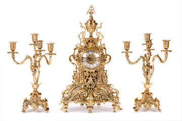 Vintage gold watch with candelabra on white background